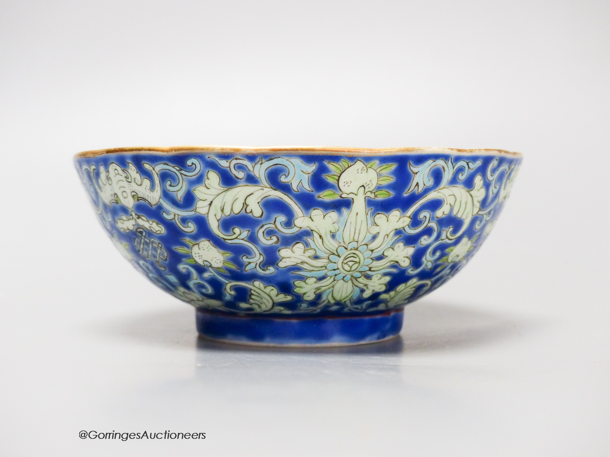 A Chinese blue ground bowl, Tongzhi mark and period (1862-74), 13cm diameter